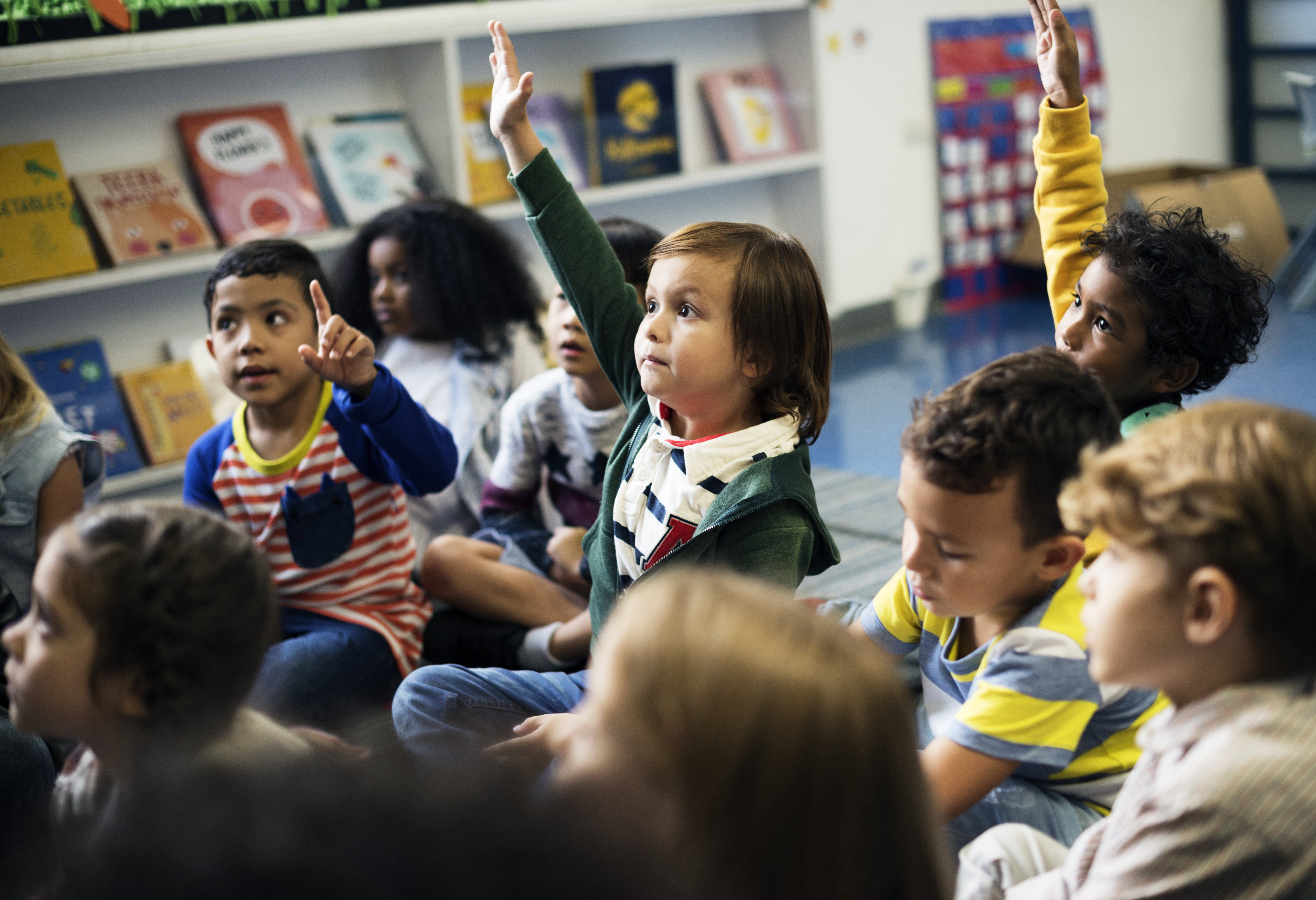  Children participating attentively in a lesson.